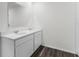 Double vanity bathroom with white cabinets and flooring at 5489 Hayloft Dr, Apopka, FL 32712