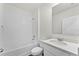 Clean bathroom with a tub and white vanity at 5489 Hayloft Dr, Apopka, FL 32712