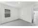 Bright bedroom with grey carpet and a window at 5489 Hayloft Dr, Apopka, FL 32712