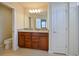 Double vanity bathroom with granite countertop and large mirror at 5650 Wooden Pine Dr, Orlando, FL 32829