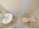 Clean bathroom with pedestal sink and toilet at 5650 Wooden Pine Dr, Orlando, FL 32829