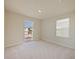 Bedroom with private balcony access and window blinds at 5650 Wooden Pine Dr, Orlando, FL 32829