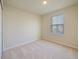 Simple bedroom with neutral walls and carpeted floor at 5650 Wooden Pine Dr, Orlando, FL 32829