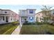 Two-story house with balcony, walkway and landscaping at 5650 Wooden Pine Dr, Orlando, FL 32829