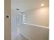 Bright hallway with neutral walls and carpeting at 5650 Wooden Pine Dr, Orlando, FL 32829