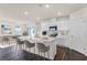 Modern kitchen with white cabinets, quartz countertops, and island at 5871 Galloping Dr, Apopka, FL 32712