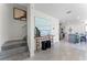 Modern staircase with gray carpeting and a console table at 6022 Galloping Dr, Apopka, FL 32712