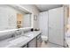 Modern bathroom with a gray vanity, a large mirror, and a shower at 623 Yorkshire Dr, Oviedo, FL 32765