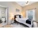 Bright bedroom featuring a queen-size bed and an ensuite bathroom at 623 Yorkshire Dr, Oviedo, FL 32765