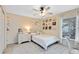 Charming bedroom with a double bed, white dresser, and window at 623 Yorkshire Dr, Oviedo, FL 32765