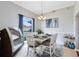 Dining room with white table, chairs, and a large window at 623 Yorkshire Dr, Oviedo, FL 32765