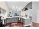 Modern kitchen with gray cabinets, quartz countertops, and stainless steel appliances at 623 Yorkshire Dr, Oviedo, FL 32765