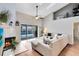 Bright living room featuring a fireplace and sliding glass doors leading to the pool at 623 Yorkshire Dr, Oviedo, FL 32765