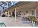 Inviting poolside patio with seating and string lights at 623 Yorkshire Dr, Oviedo, FL 32765