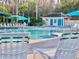 Community pool with fountains and lounge chairs at 6879 Remington View Ct, Orlando, FL 32829