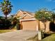 Two-story house with a three-car garage at 6879 Remington View Ct, Orlando, FL 32829