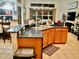 Kitchen island with breakfast bar and dark granite countertops at 6879 Remington View Ct, Orlando, FL 32829