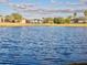 Calm lake view with houses in background at 6879 Remington View Ct, Orlando, FL 32829