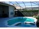 Inviting pool and spa with a screened enclosure and lush landscaping at 6879 Remington View Ct, Orlando, FL 32829