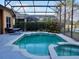 Relaxing screened pool and spa with a patio area at 6879 Remington View Ct, Orlando, FL 32829