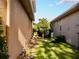 Landscaped side yard with a stone pathway at 6879 Remington View Ct, Orlando, FL 32829