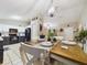 Bright dining area with a wood table and white chairs, adjacent to the kitchen at 6928 Sw 152Nd St, Ocala, FL 34473