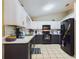 Modern kitchen with black and white cabinets, new appliances, and quartz countertops at 6928 Sw 152Nd St, Ocala, FL 34473