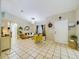 Living room with a yellow accent chair and a comfortable sofa at 6928 Sw 152Nd St, Ocala, FL 34473