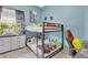 bedroom with bunk bed, desk, and whimsical decor at 752 Americana Ct, Kissimmee, FL 34758