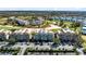 Aerial view of the community, showcasing lush landscaping at 7618 Sandy Ridge Dr # 103, Reunion, FL 34747