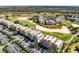 Aerial view of the community, showcasing golf course at 7618 Sandy Ridge Dr # 103, Reunion, FL 34747