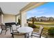 Relaxing patio with seating area and golf course view at 7618 Sandy Ridge Dr # 103, Reunion, FL 34747