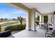 Relaxing patio featuring views of the lush green golf course at 7618 Sandy Ridge Dr # 103, Reunion, FL 34747