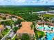 Aerial view of community with pool and lush landscape at 7654 Comrow St # 101, Kissimmee, FL 34747