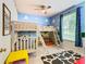 Toy Story themed bedroom with bunk beds, colorful decor, and playful accents at 7654 Comrow St # 101, Kissimmee, FL 34747