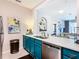 Modern teal kitchen with sink and dishwasher at 7654 Comrow St # 101, Kissimmee, FL 34747