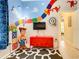 Fun ' play area featuring a Toy Story theme, games, and a TV at 7654 Comrow St # 101, Kissimmee, FL 34747