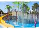 Colorful splash pad with slides and sprinklers at 7654 Comrow St # 101, Kissimmee, FL 34747