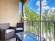 Relaxing screened balcony overlooking trees and buildings at 7664 Comrow St # 301, Kissimmee, FL 34747