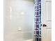 Bathroom with shower/tub combo and gray shower curtain at 7664 Comrow St # 301, Kissimmee, FL 34747