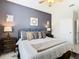 Spacious bedroom with king-size bed and en-suite bathroom at 7664 Comrow St # 301, Kissimmee, FL 34747