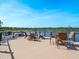 Spacious lakefront deck with seating and table at 10110 Royal Island Ct, Orlando, FL 32836