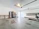 Garage with workbench and storage shelving at 11024 Folklore Street, Winter Garden, FL 34787