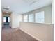 Upstairs hallway with carpeted flooring and access to bedrooms at 11024 Folklore Street, Winter Garden, FL 34787