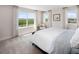 Bright bedroom with large windows offering scenic views and plush carpeting at 12439 Shipwatch St, Orlando, FL 32832