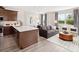 Open concept kitchen with island and stainless steel appliances at 12439 Shipwatch St, Orlando, FL 32832