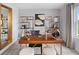 Home office with wooden desk and gold accents at 12439 Shipwatch St, Orlando, FL 32832