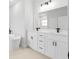 Elegant bathroom with a freestanding tub, double vanity, and modern black fixtures at 15033 Sw 35Th Cir, Ocala, FL 34473