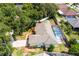 Aerial view of home with a screened-in pool, a fenced yard, and mature trees at 1569 Victoria Way, Winter Garden, FL 34787