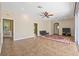 Inviting living area boasting tile floors, access to other rooms, a ceiling fan, and plenty of room at 1569 Victoria Way, Winter Garden, FL 34787